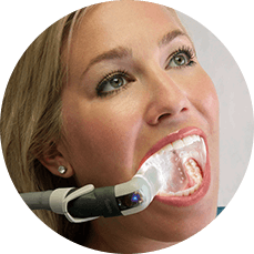 woman having her teeth examined