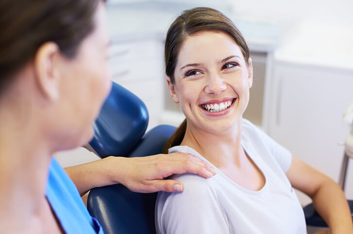 woman smiling in the dental chair