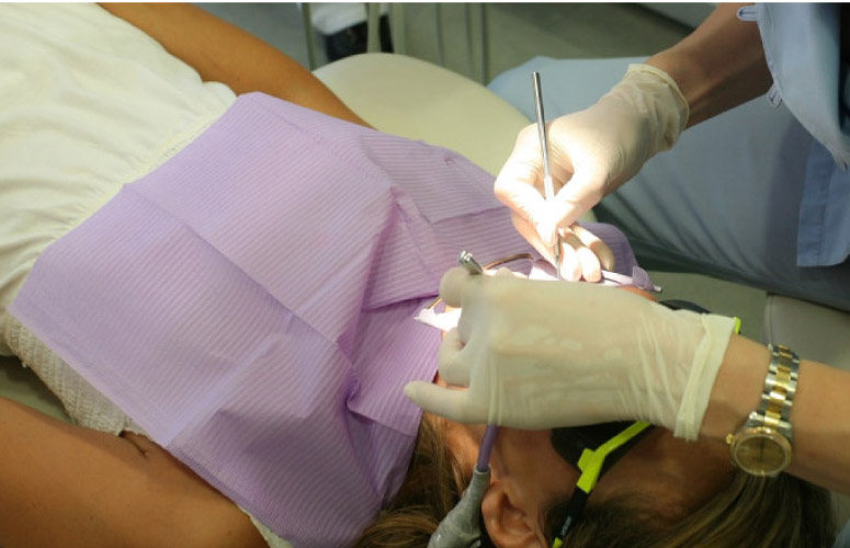 dental patient undergoing root canal surgery